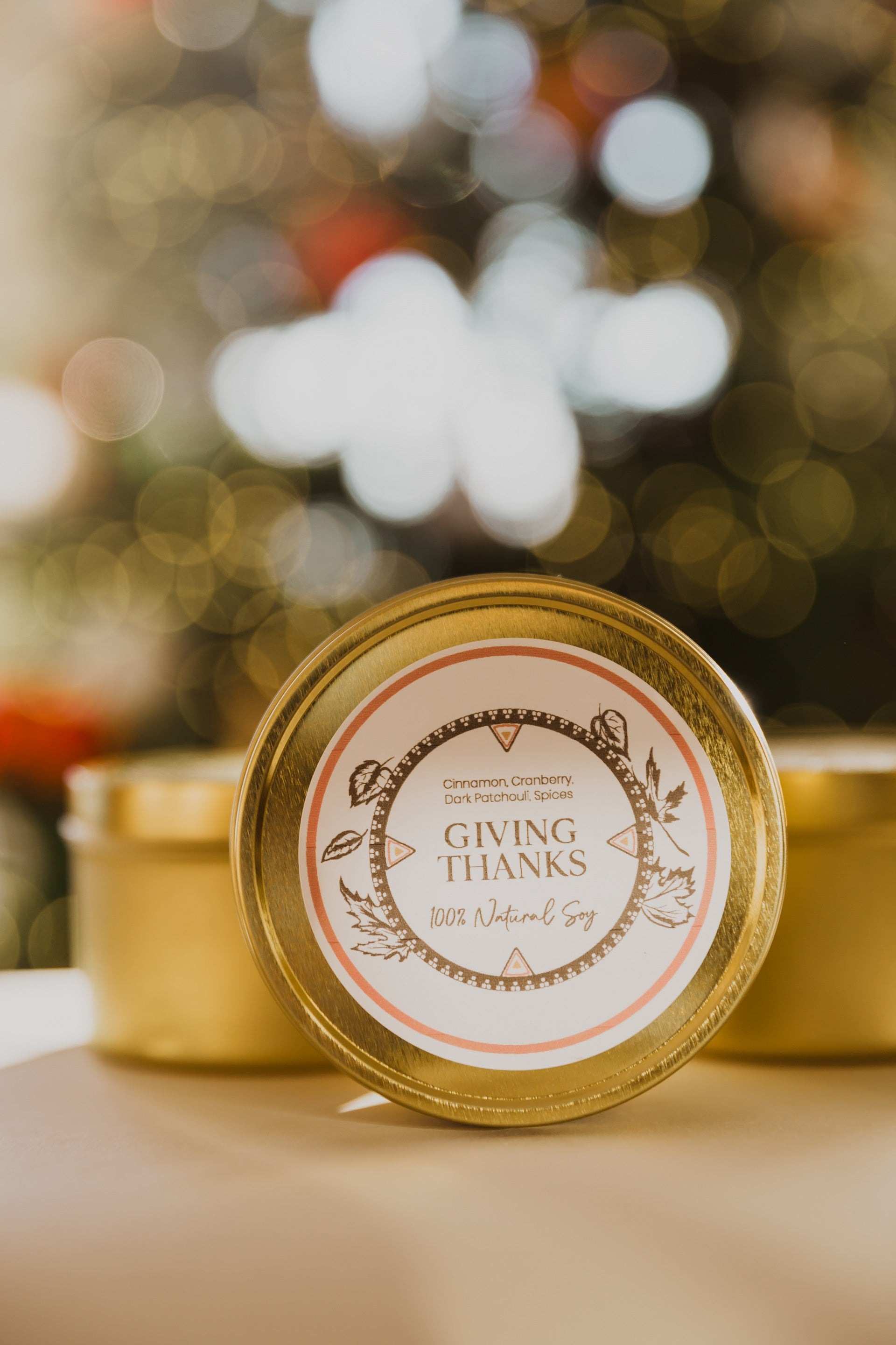 A trio of 8oz travel tins by LODGE Soy Candles with the Giving Thanks tin in the front.