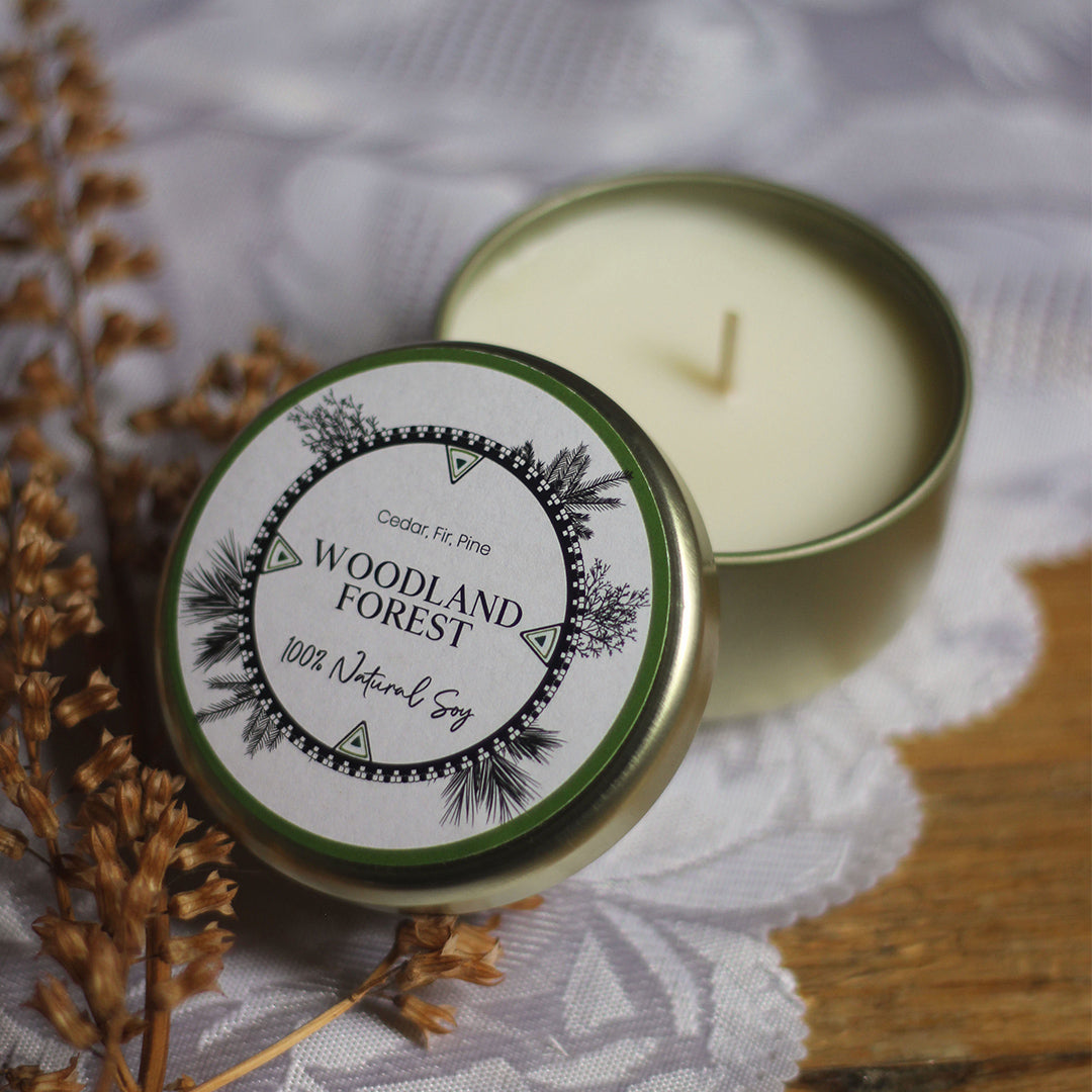 LODGE Soy Candles' 4oz travel tin in Woodland Forest brings a fresh and woodsy scent with you anywhere you go!