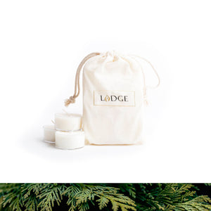 A pack of six tealight candles in the scent Woodland Forest by LODGE Soy Candles.